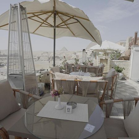Queen Cleopatra Pyramids Hotel ไคโร ภายนอก รูปภาพ