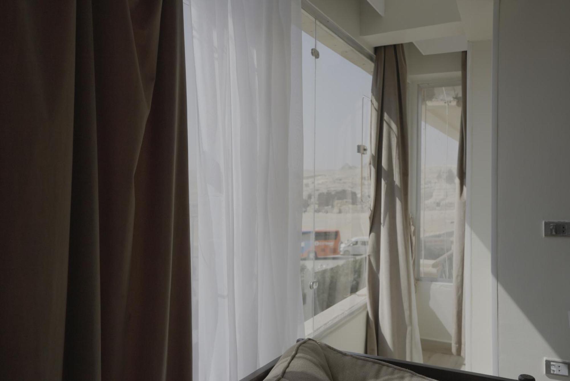 Queen Cleopatra Pyramids Hotel ไคโร ภายนอก รูปภาพ